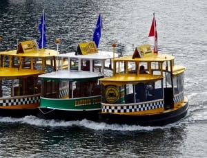 yellow green and white river boat thumbnail