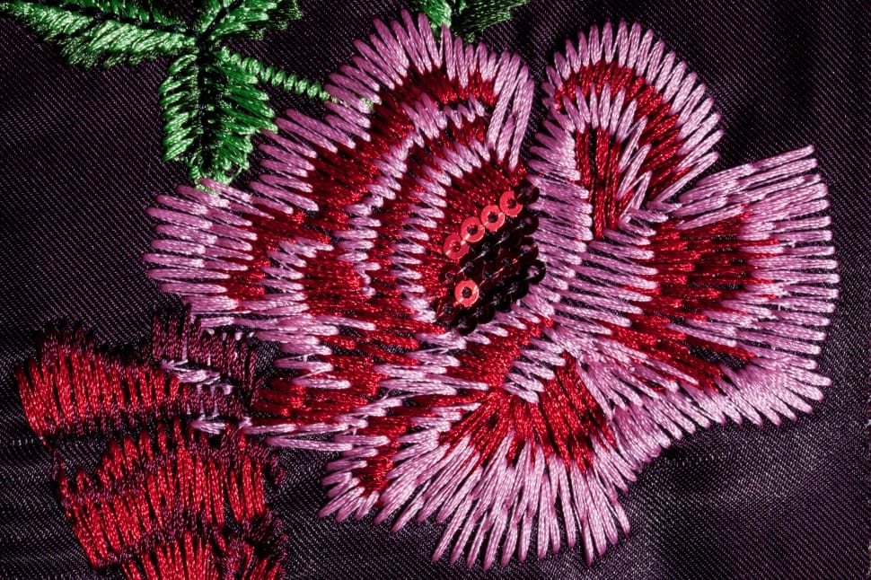 pink red black and green floral textile preview