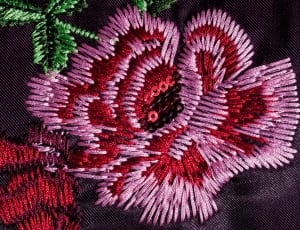 pink red black and green floral textile thumbnail