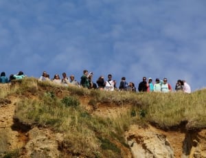 group of people on top of mountain thumbnail