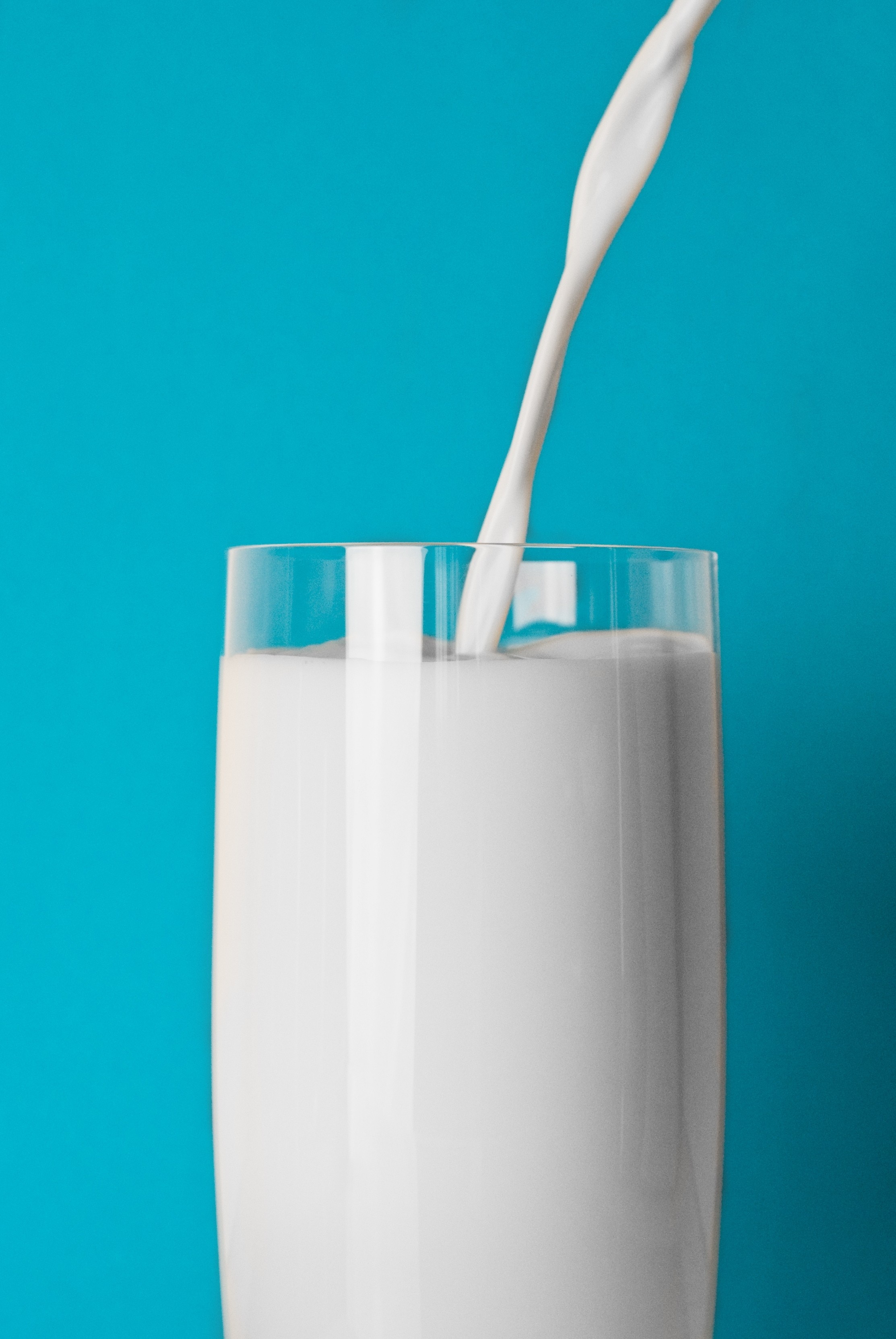 milk in clear drinking glass