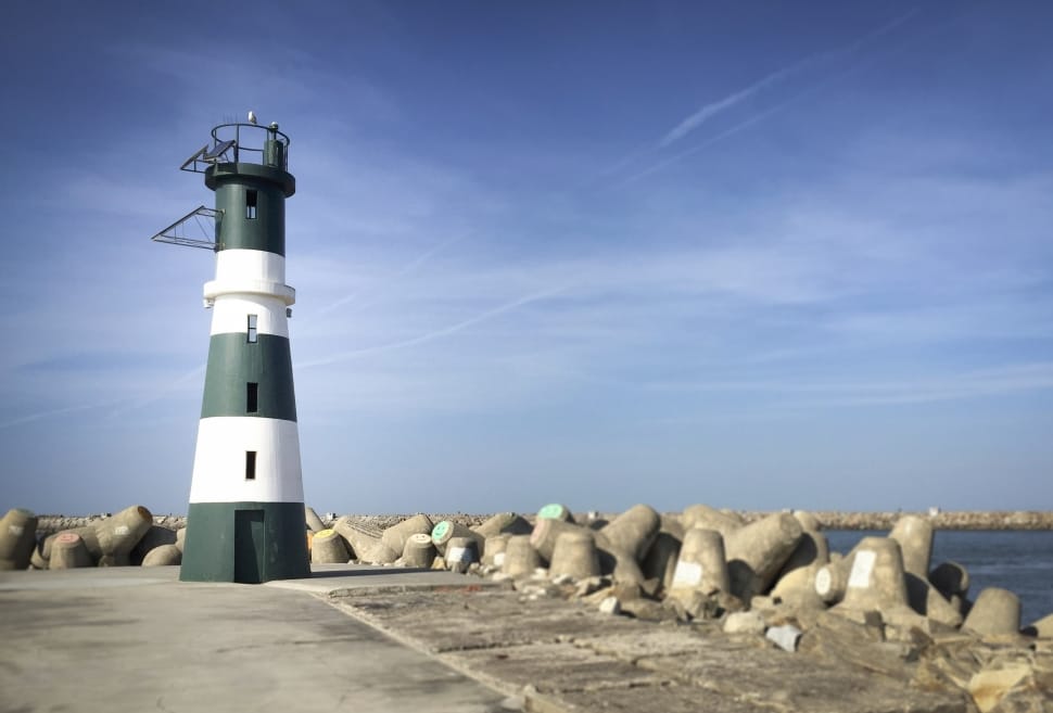 white and green concrete lighthouse preview