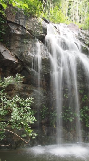 brown rock in waterfalls thumbnail