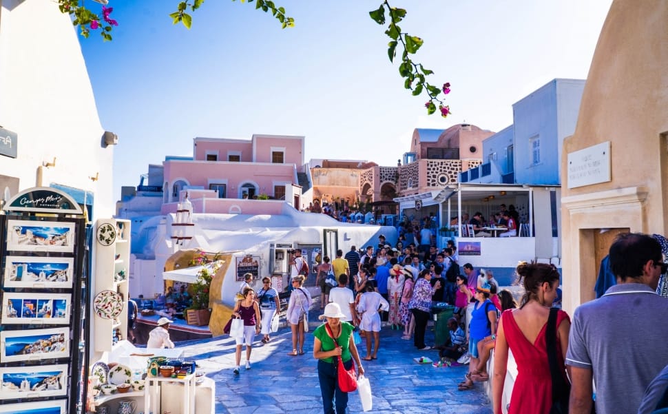 people walking at  Santorini under clear blue sky preview