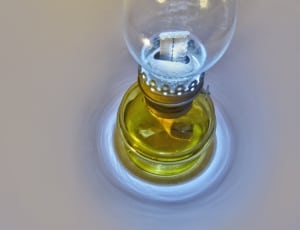yellow and clear glass kerosine lamp thumbnail