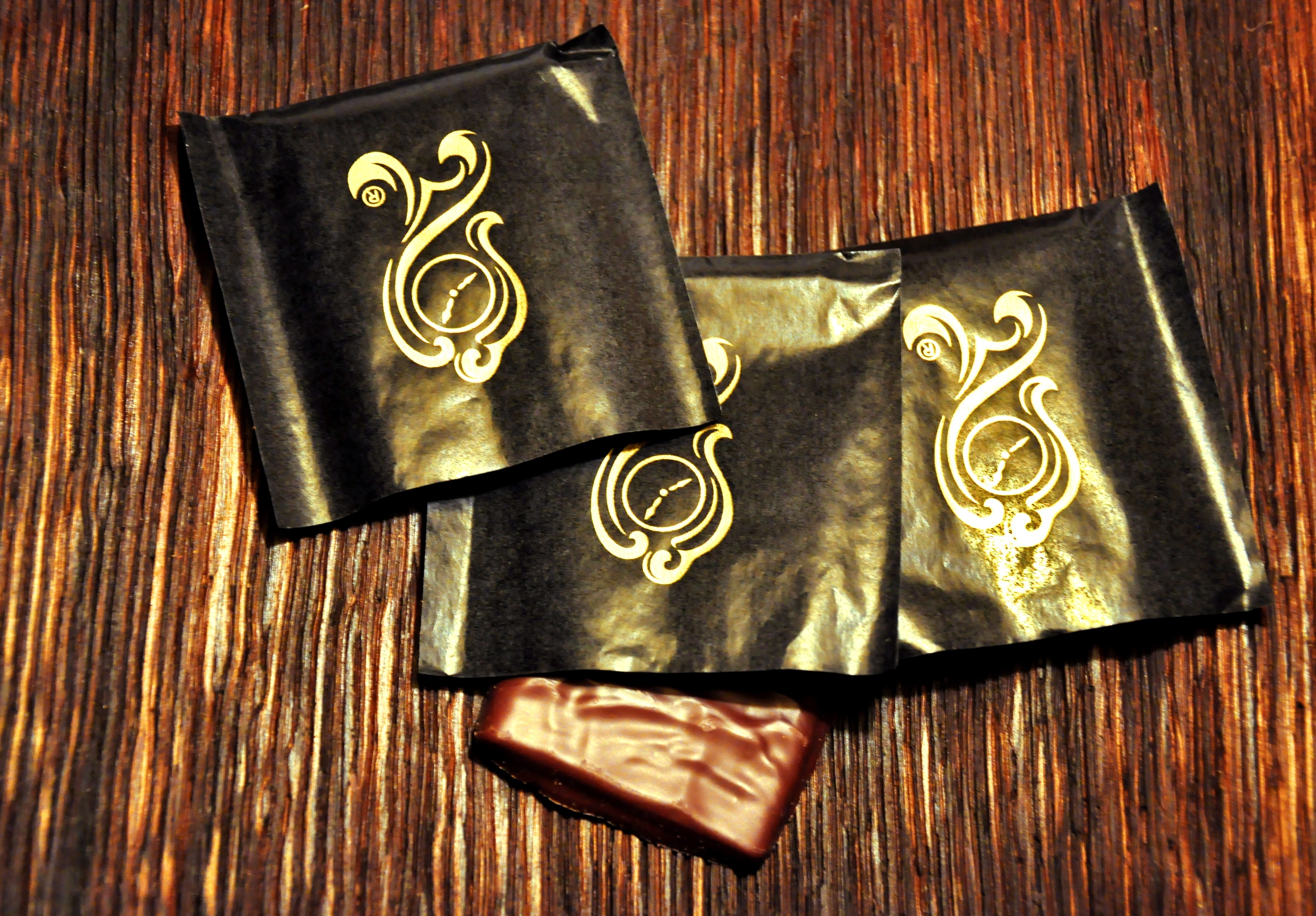 three black printed pouches