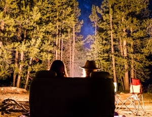 man and woman sitting on couch outdoors thumbnail