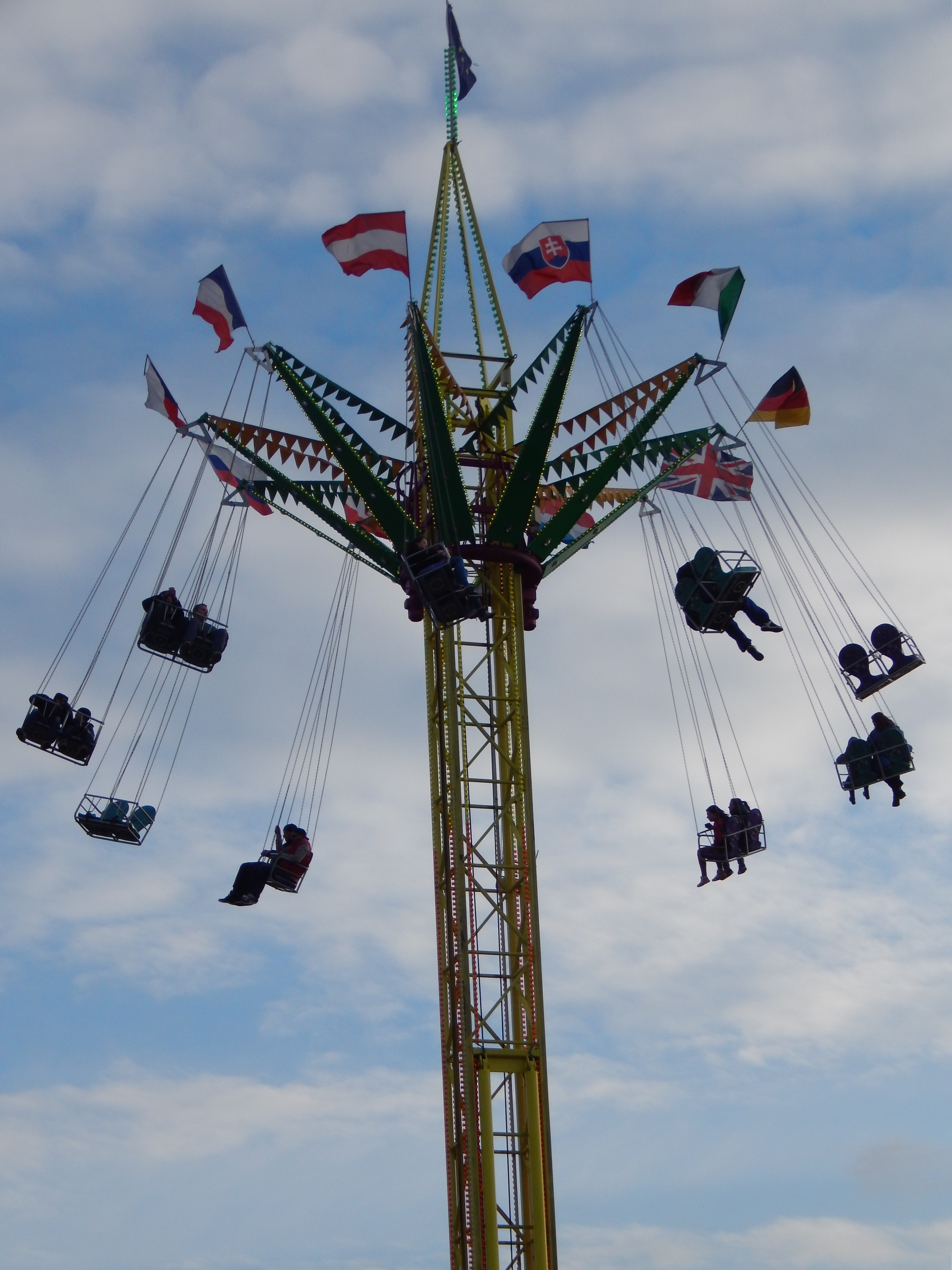 silhouette of people riding carousel swing during time