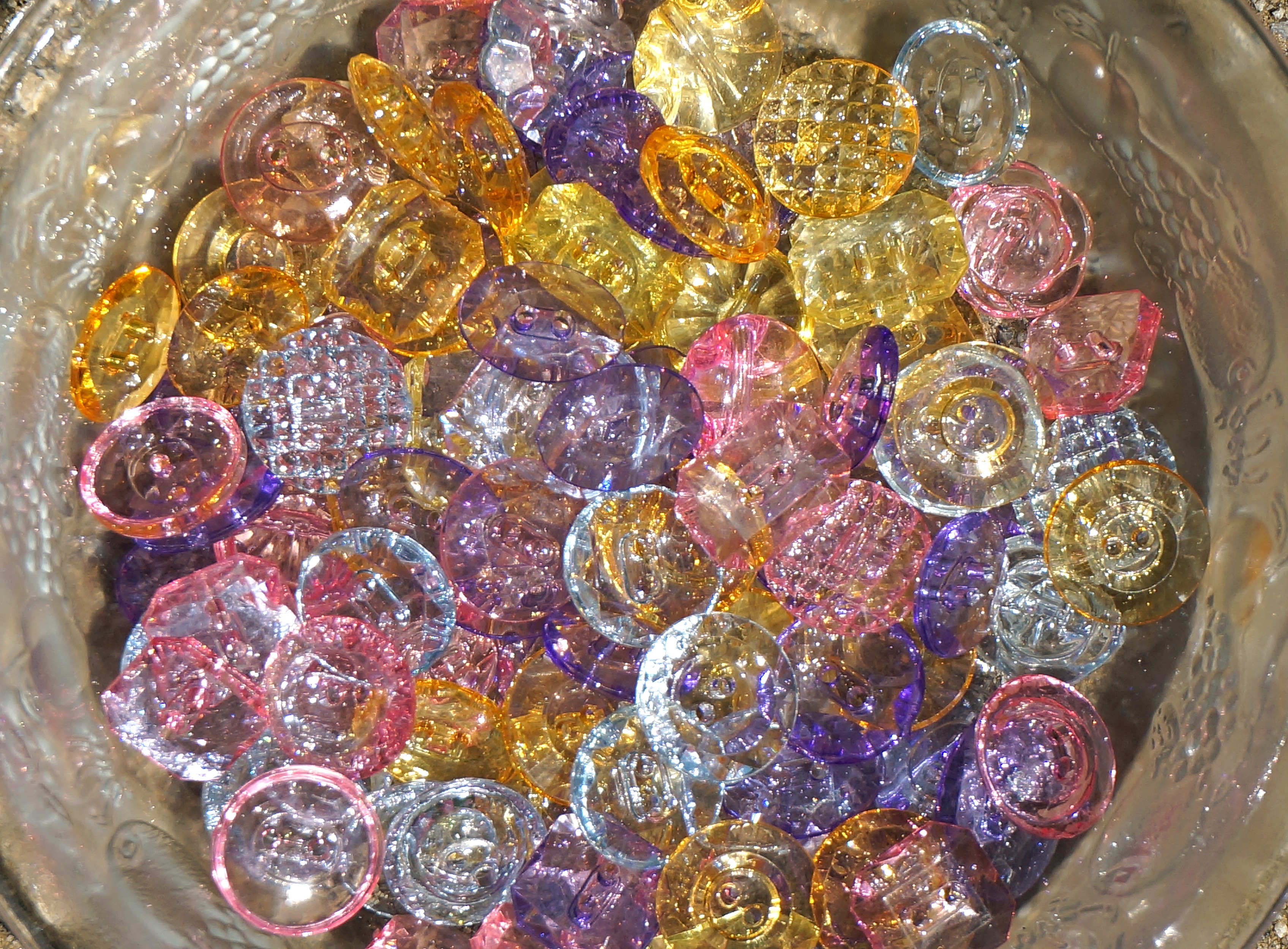 gemstones in clear glass vase