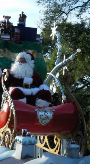 santa on red and brown sled with gifts thumbnail
