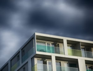 modern residential building on top of black clouds thumbnail