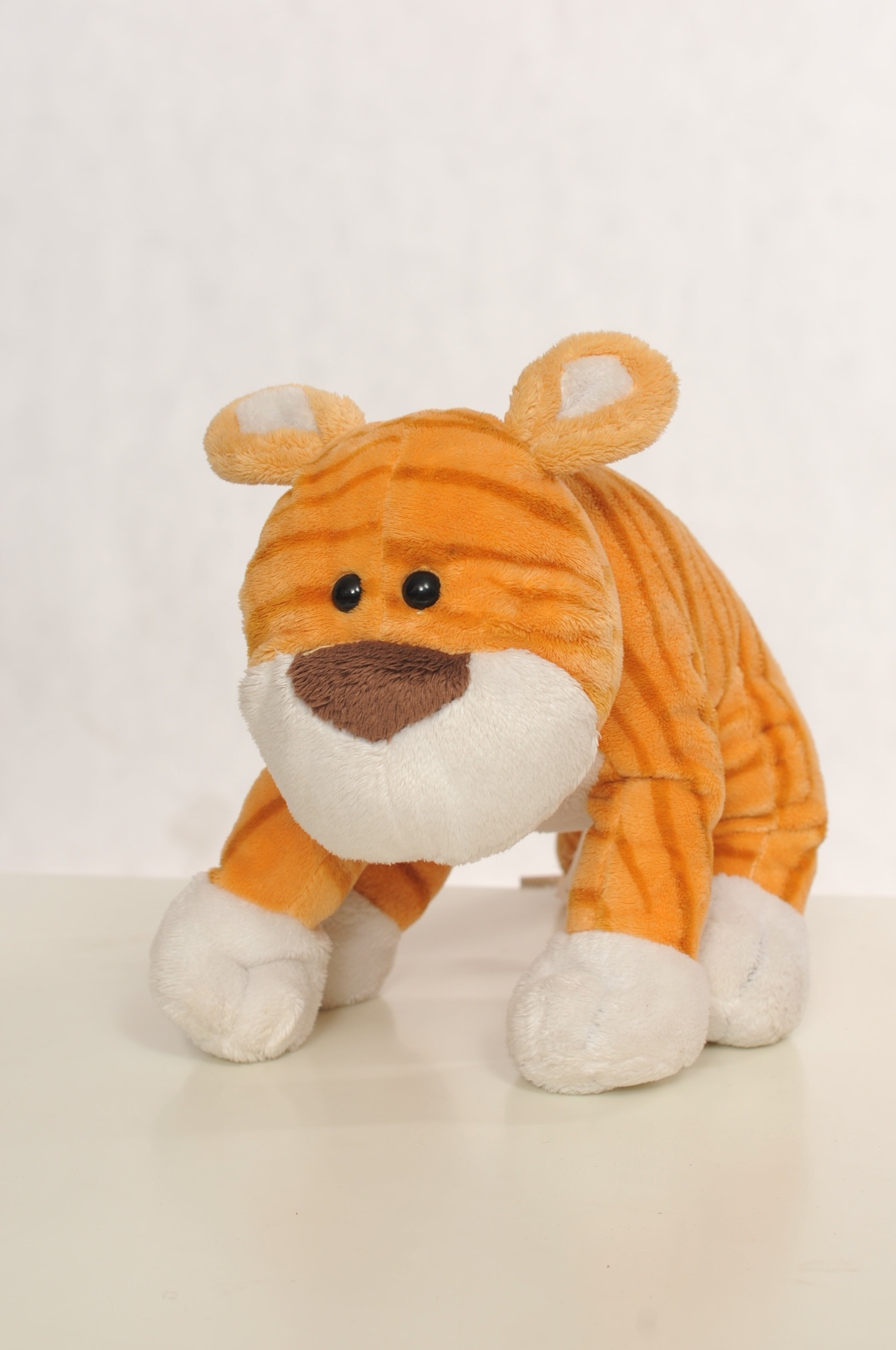 orange and white tiger plush toy