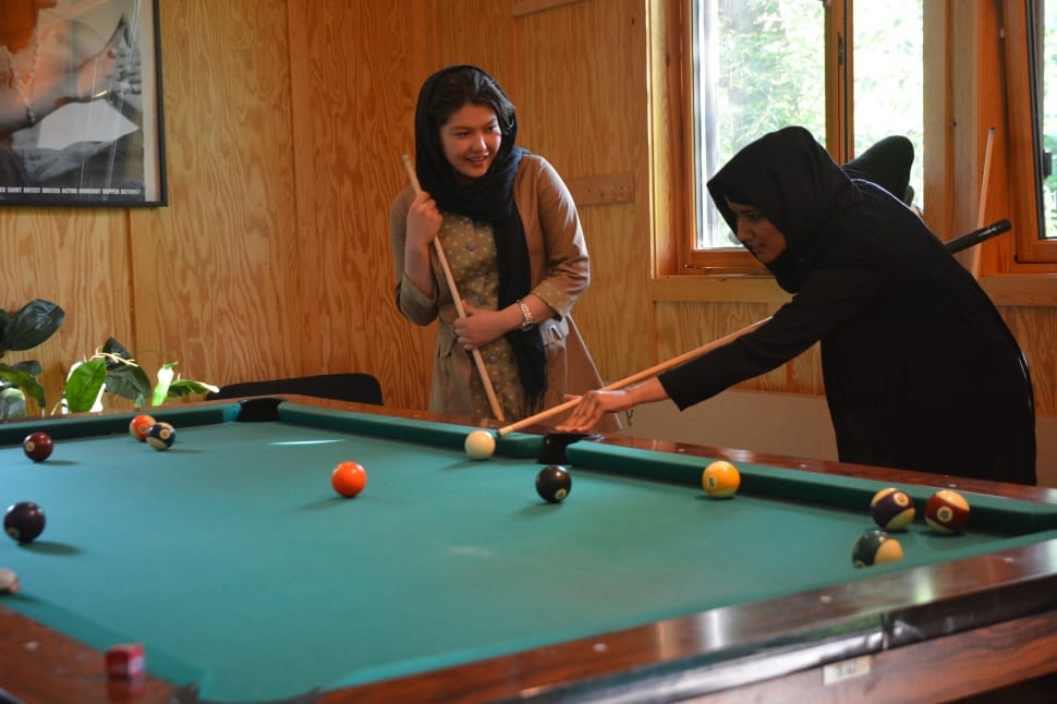 brown and green billiard set with women's black hijab preview