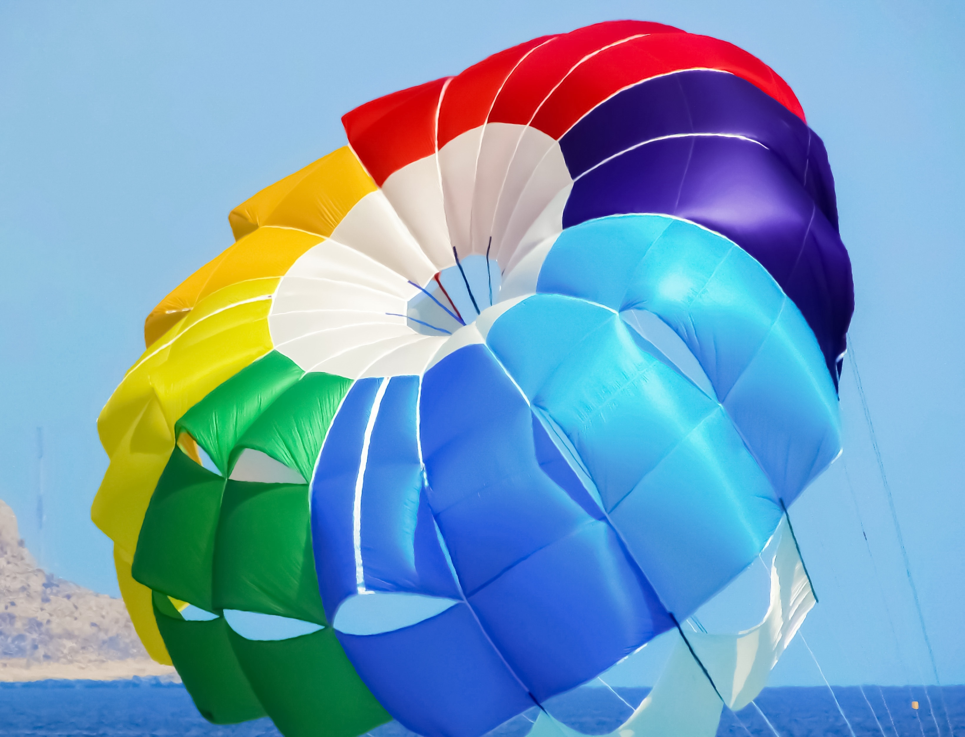 blue white green red and yellow hot air balloon