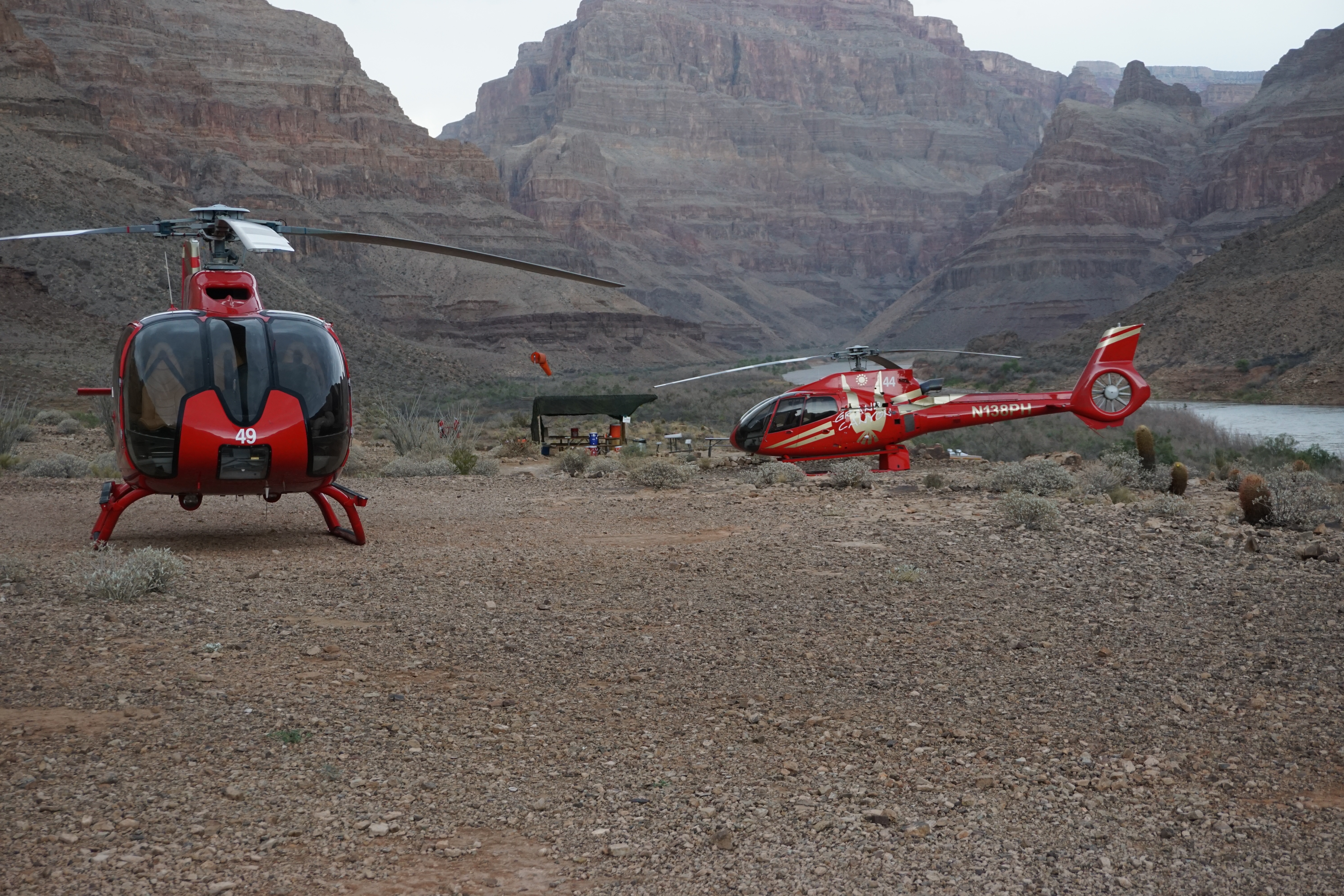 2 red helicopters