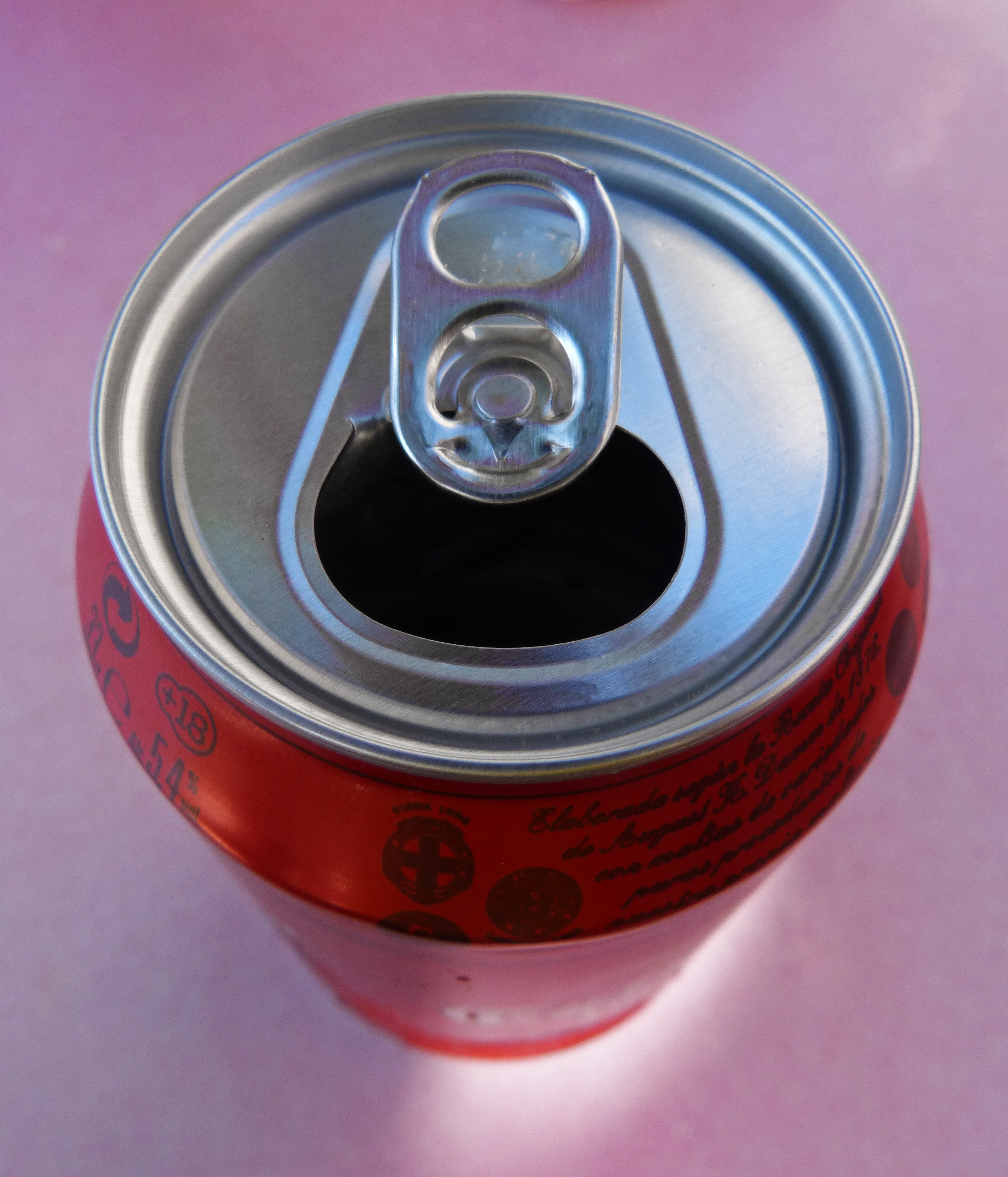 red labeled easy open can