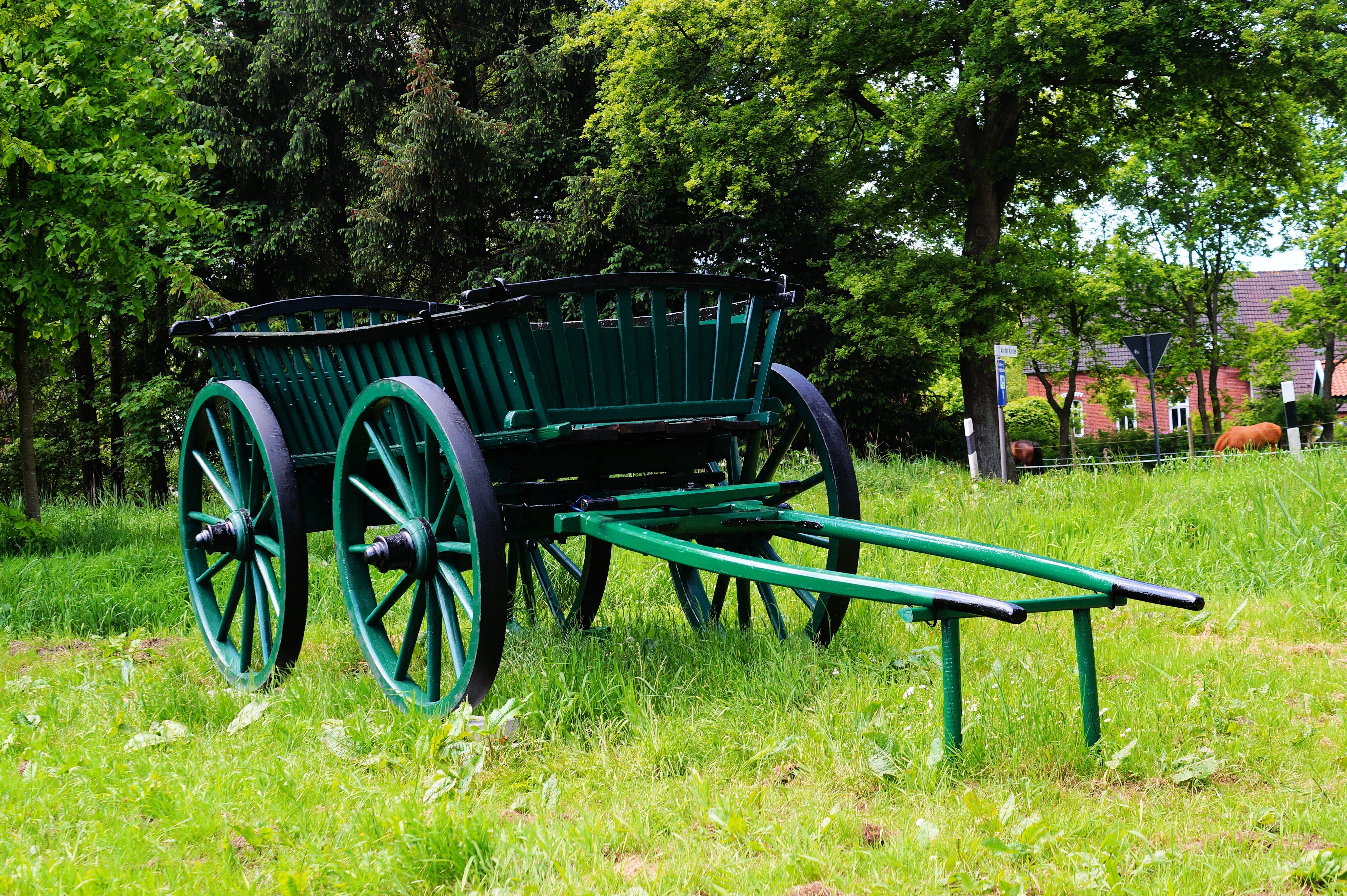 green and black wooden wagon