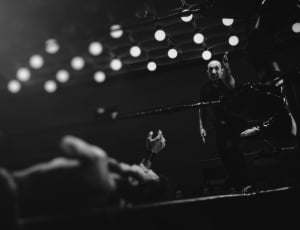 grayscale photo of wresler lying on the ring thumbnail