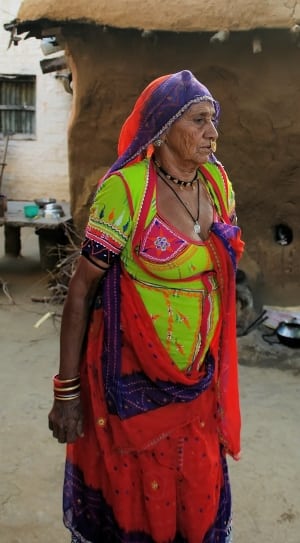 women's green and red sari thumbnail