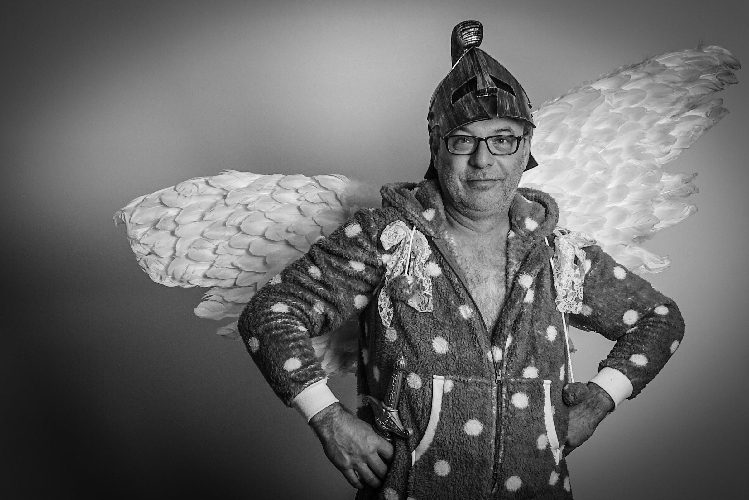 man wearing zip up jacket with wings costume