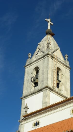 white gray and orange cathedral bell tower thumbnail