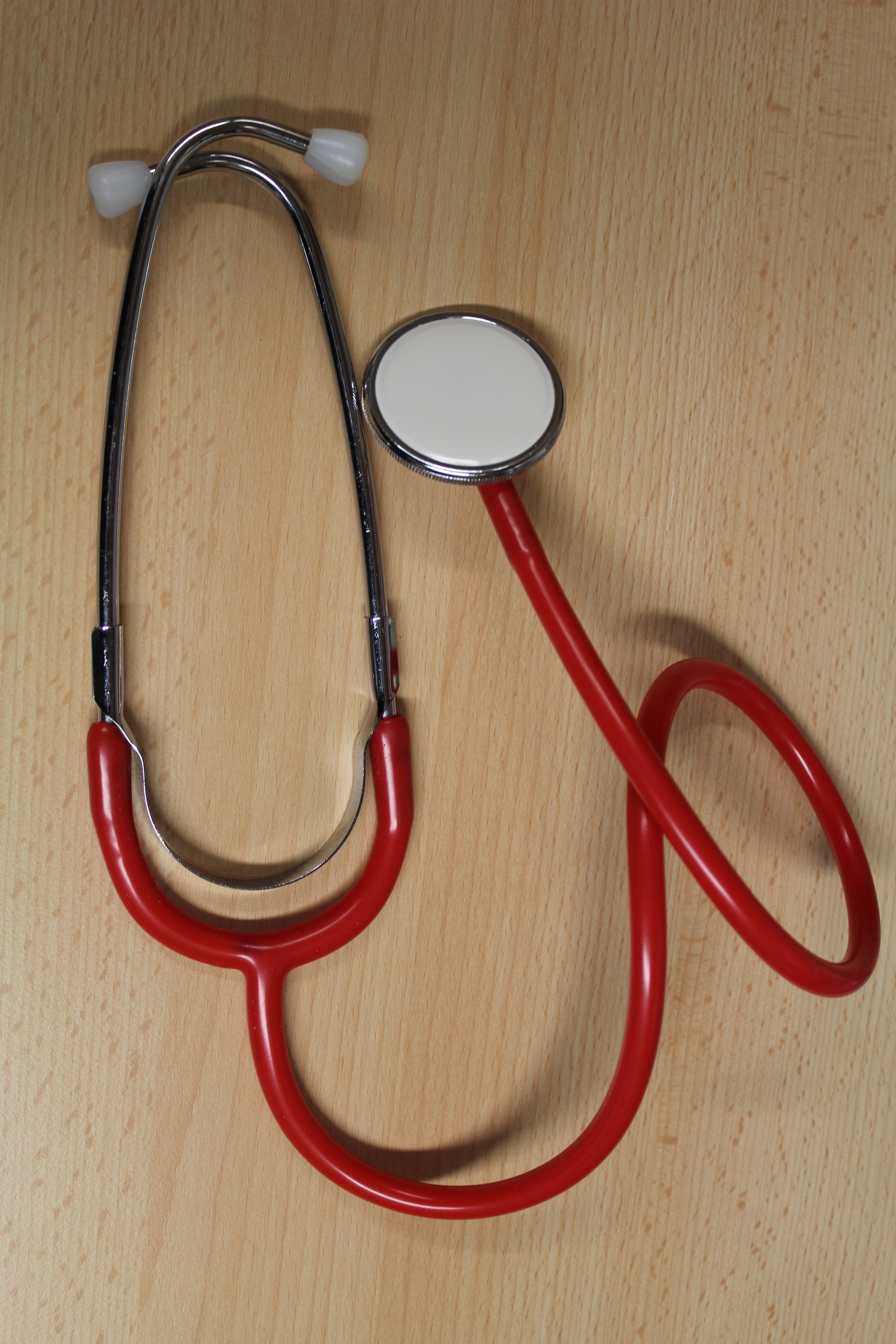 red and stainless steel stethoscope