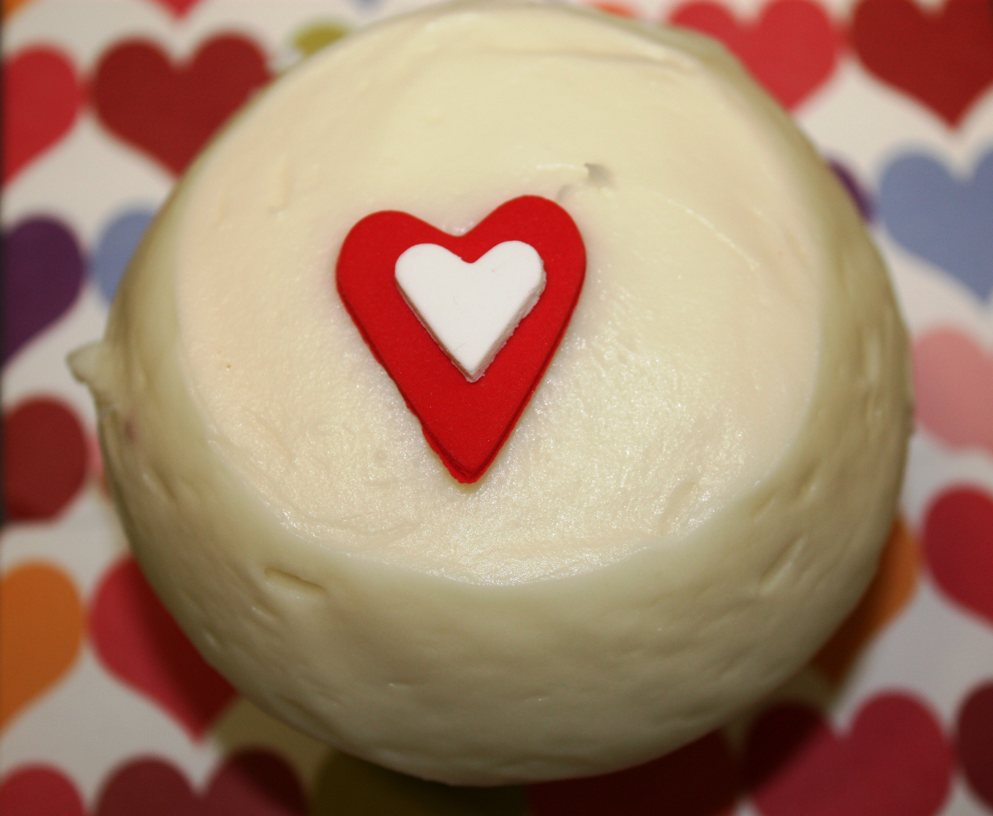round cupcake with heart icing on top