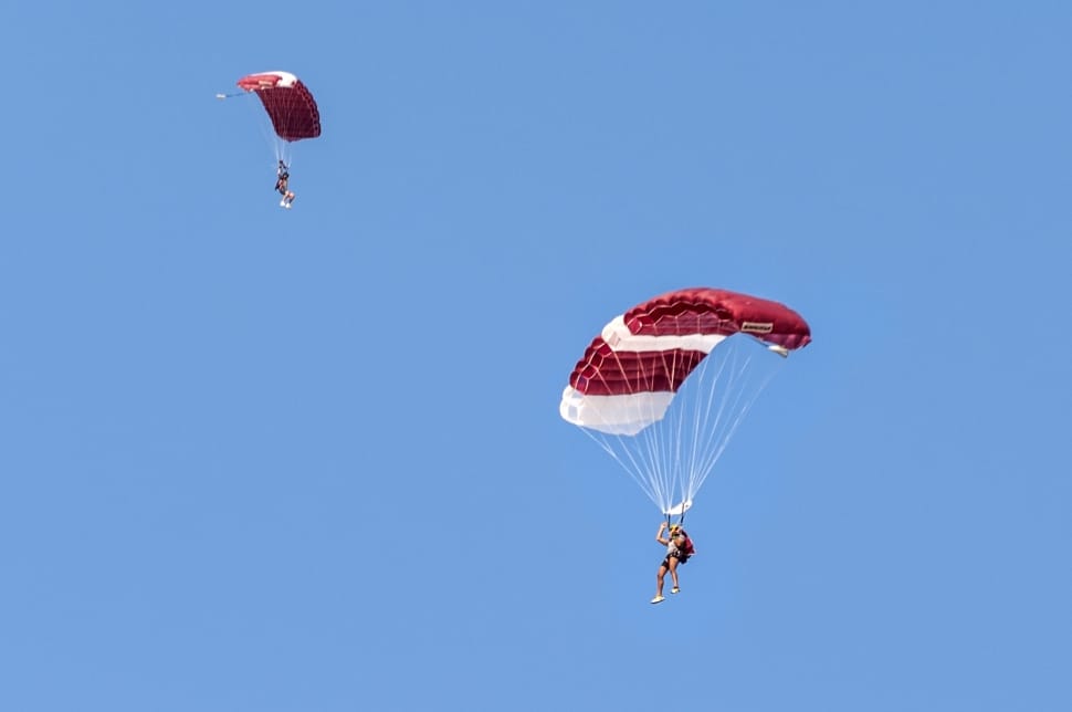 white and red paragliding preview