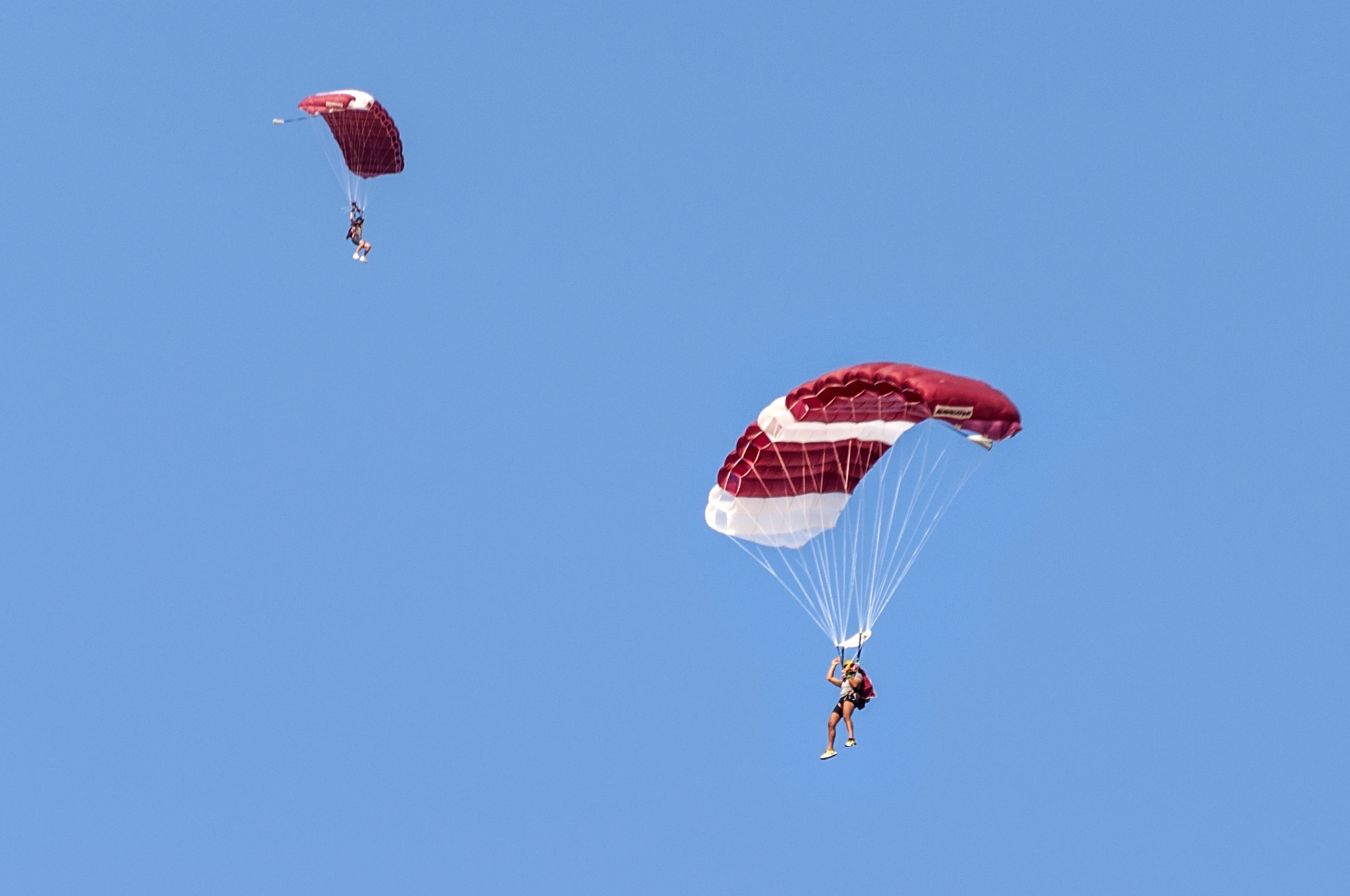white and red paragliding