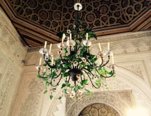 green and white candelabra chandelier with green plant thumbnail