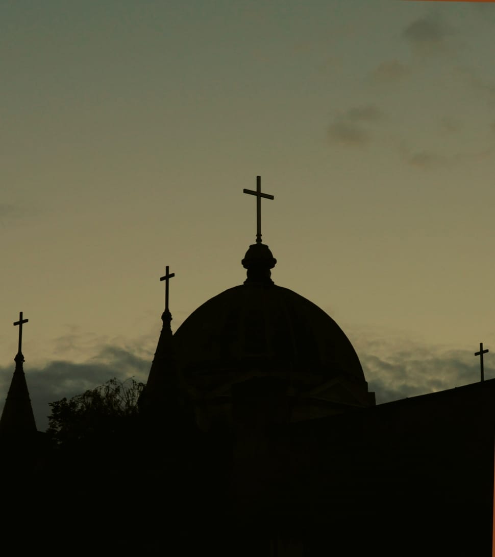 silhouette photo of a church during sunset preview