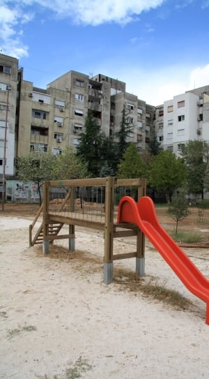 red and brown wooden outdoor slide thumbnail