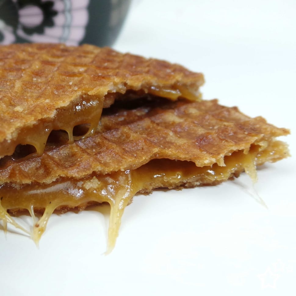 syrup filled waffle on white surface preview