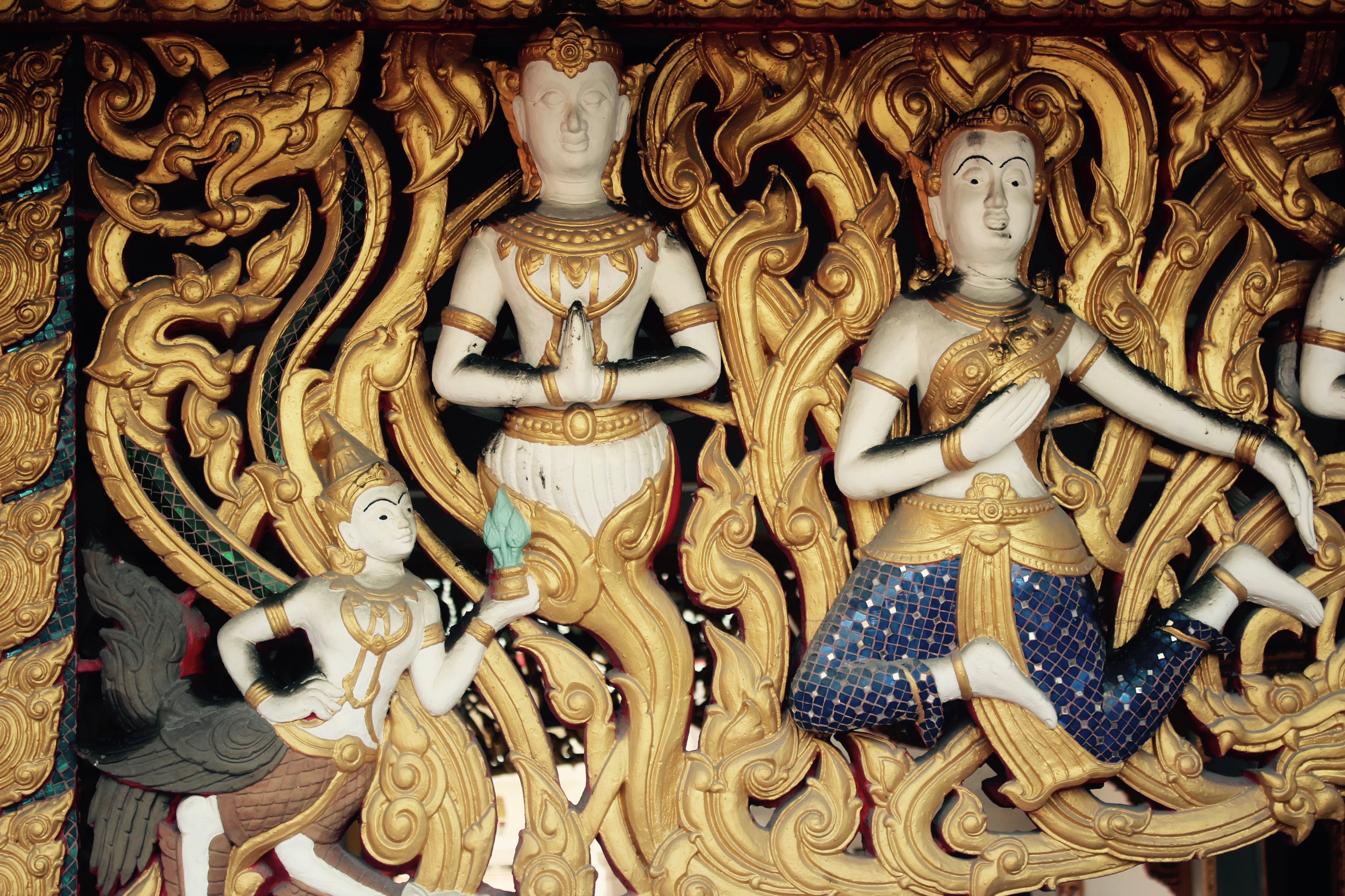 beige and brass buddha decor