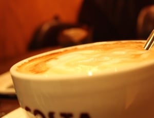 white ceramic mug filled with coffee thumbnail