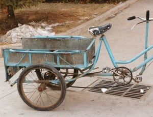 adult'sblue tricycle thumbnail
