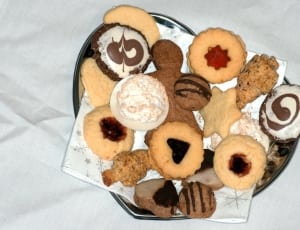 assorted cookies on top of gray steel heart shape container thumbnail