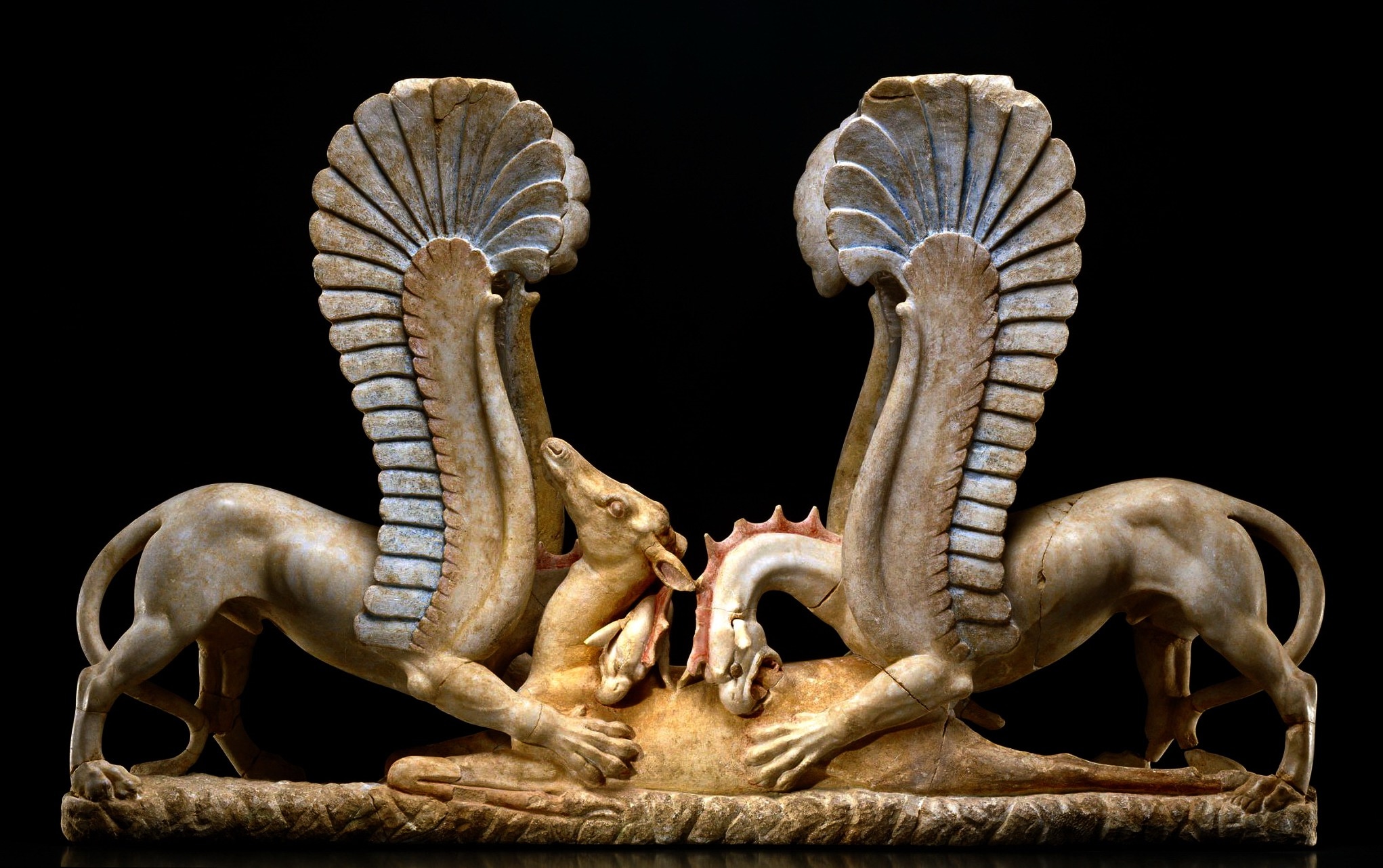 grey and brown ceramic dragon eating his prey  figurine