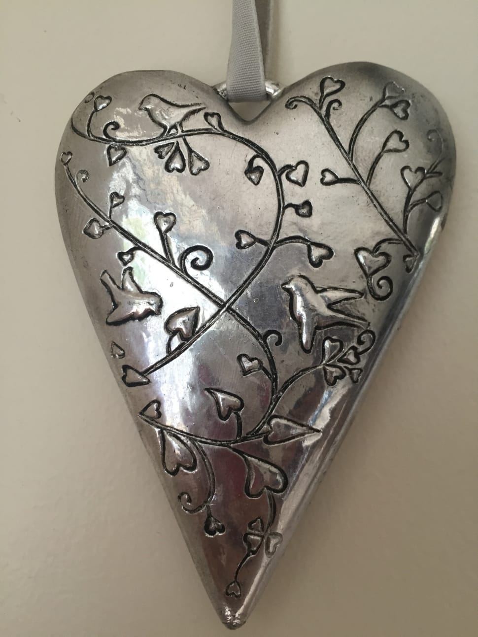 silver birds on trees with heart leaves engraved heart pendant preview