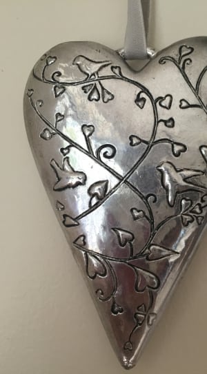silver birds on trees with heart leaves engraved heart pendant thumbnail