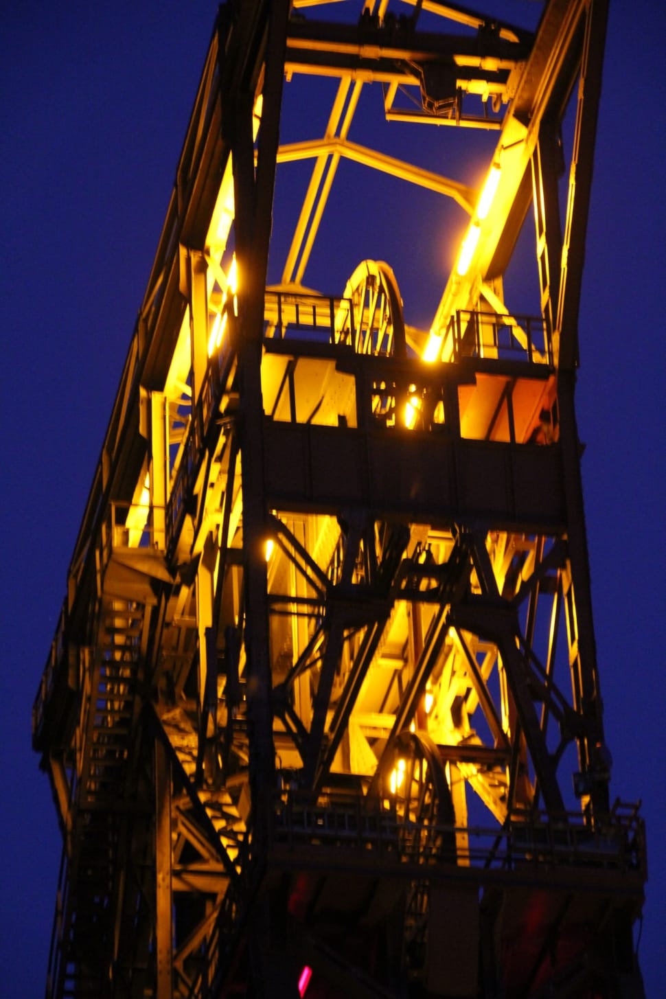 yellow and brown machinery under blue sky during nighttime preview