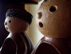 2 boy beige and brown ceramic figurine thumbnail