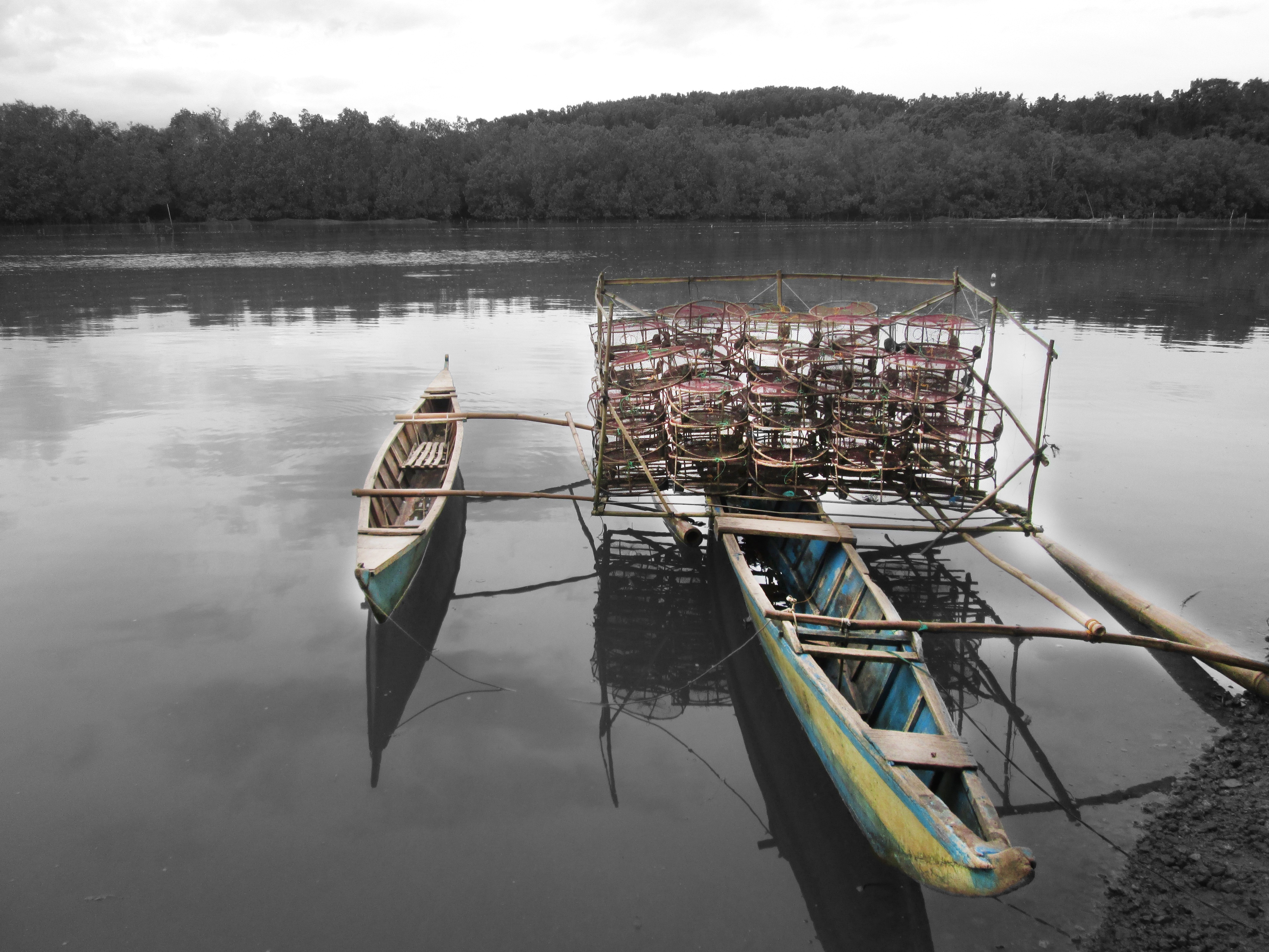 2 wooden rowboats