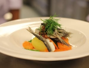 fish with green herbs in ceramic plate thumbnail