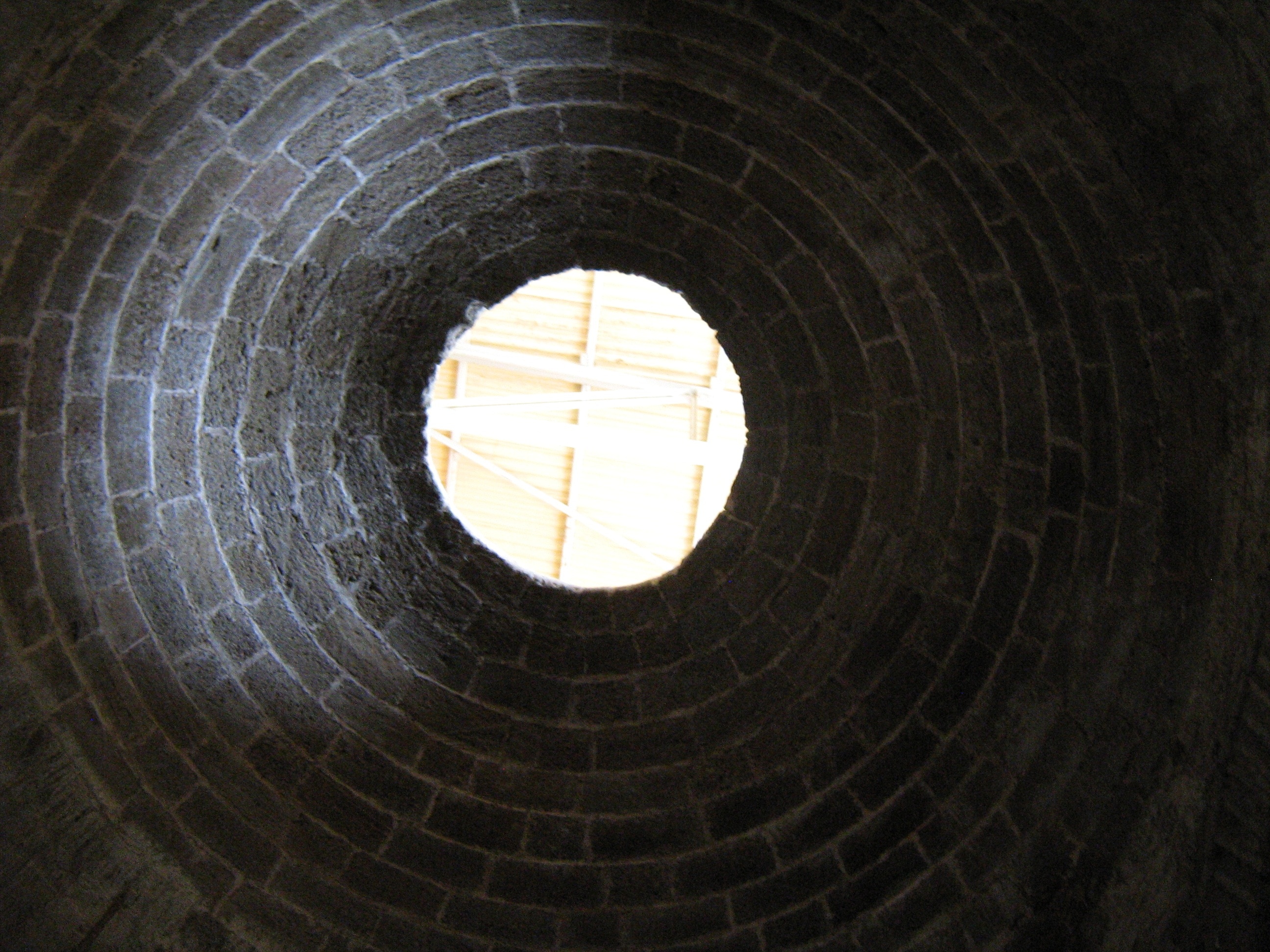 brown and gray brick tunnel
