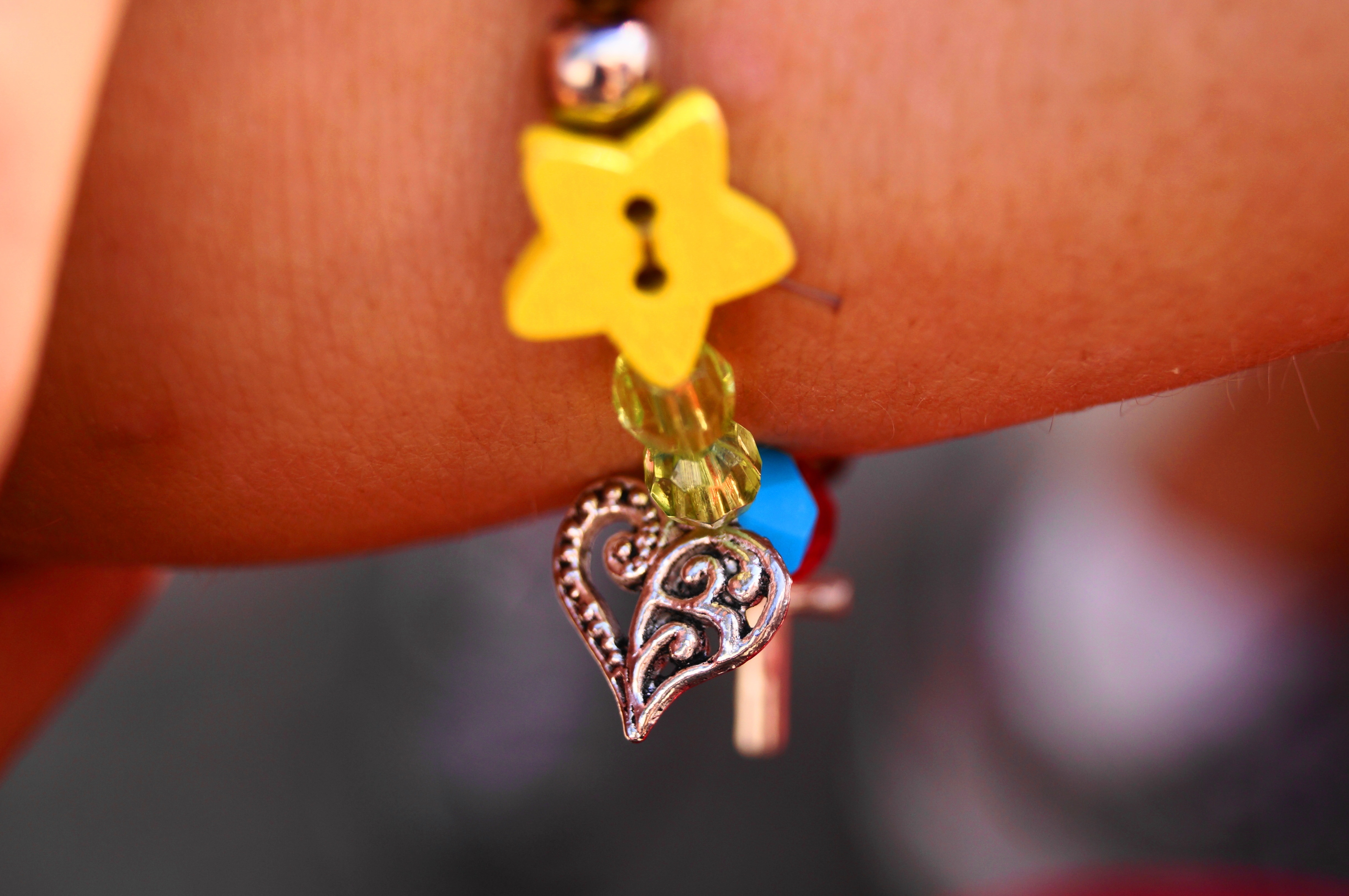 silver heart and yellow star bracelet