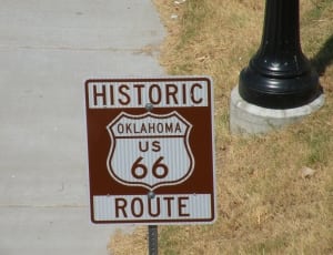 red and white oklahome us 66 historic route road sign thumbnail