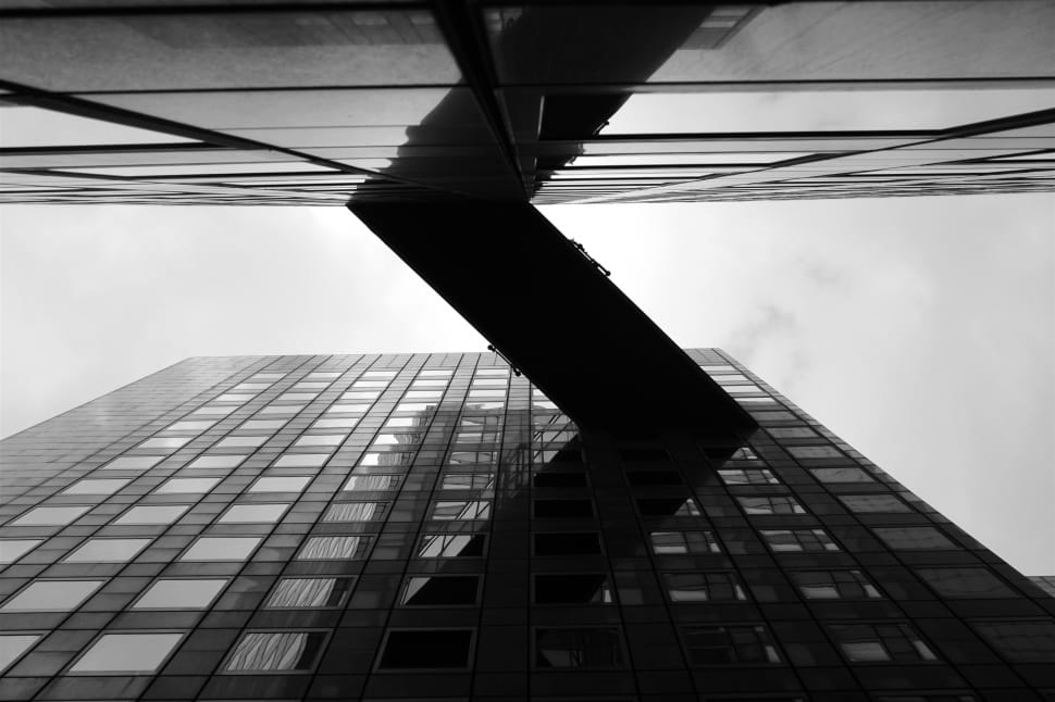 grayscale low angle photography of high rise building preview