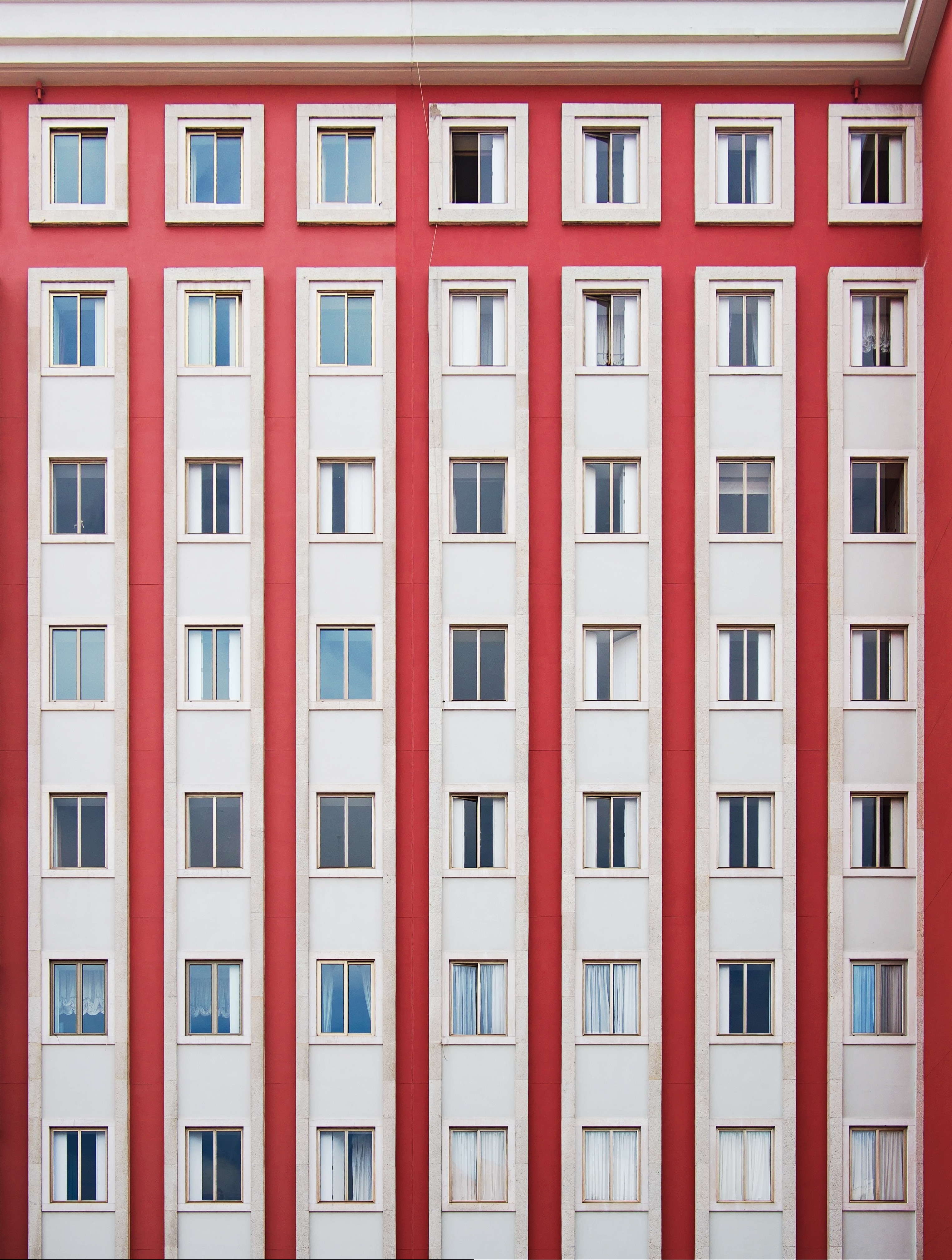 white and red apartment windows