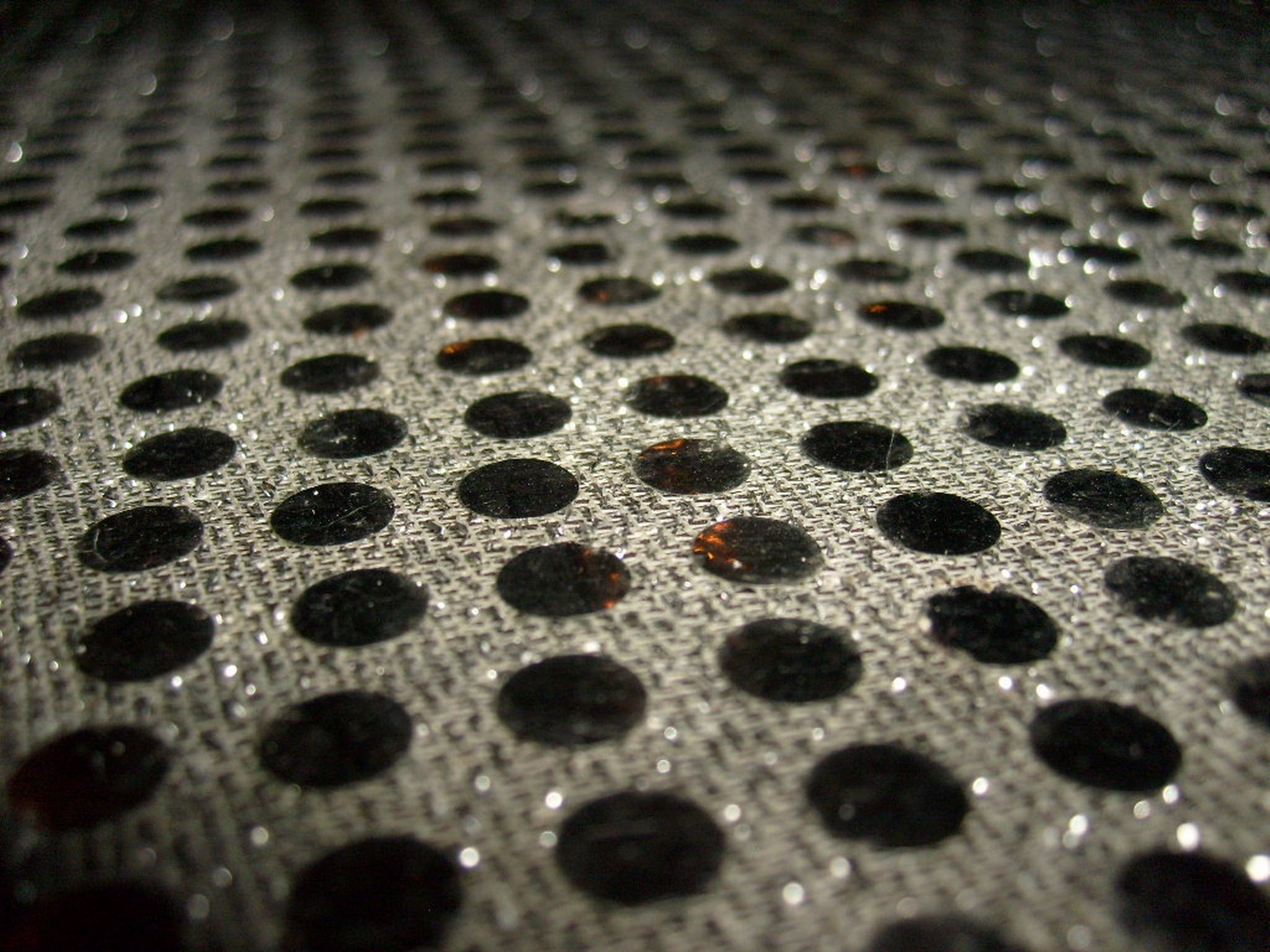 gray and black polka dot print textile